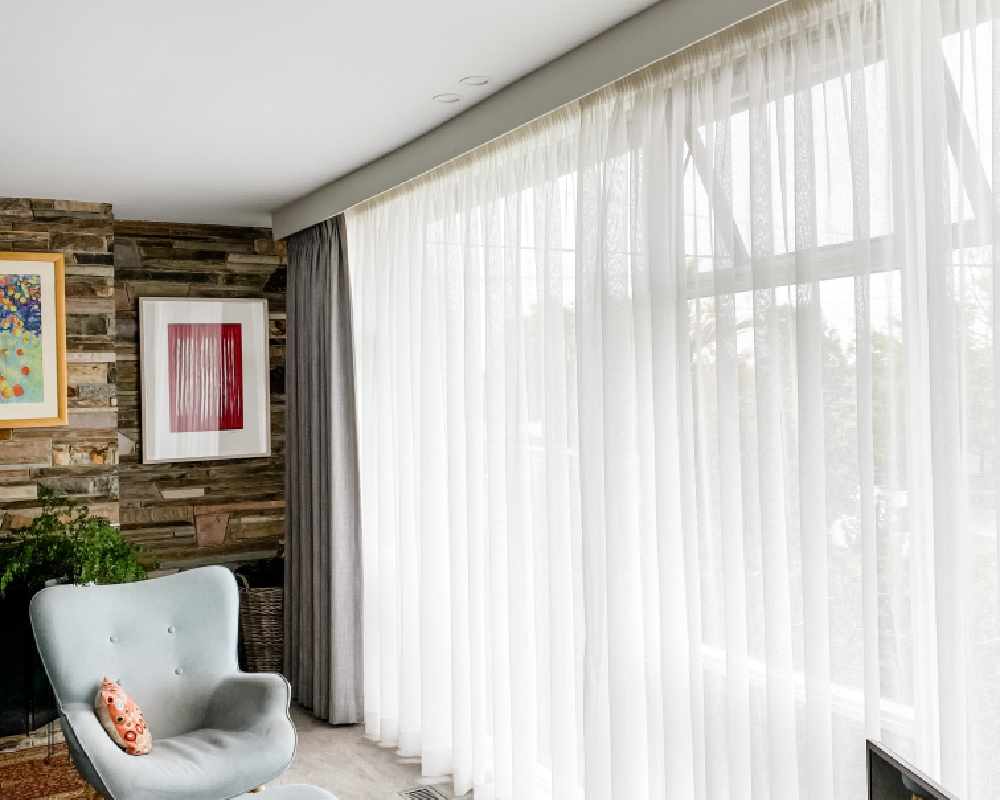 Ceiling height pinch pleat sheer curtains in Lilydale